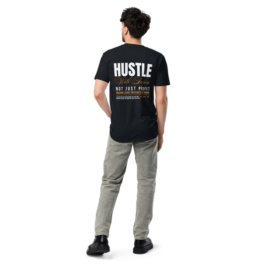 Male model wearing a navy premium mens t-shirt with the back design reading ‘Hustle With Purpose – Not Just Profit – Building Legacy Instead of Just Income’ in white, gold, and orange text.