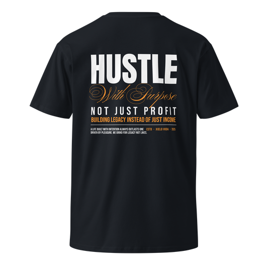 Back view of navy premium cotton t-shirt with white and gold typography reading "Hustle With Purpose – Not Just Profit – Building Legacy Instead of Just Income" by Xielo Vida.