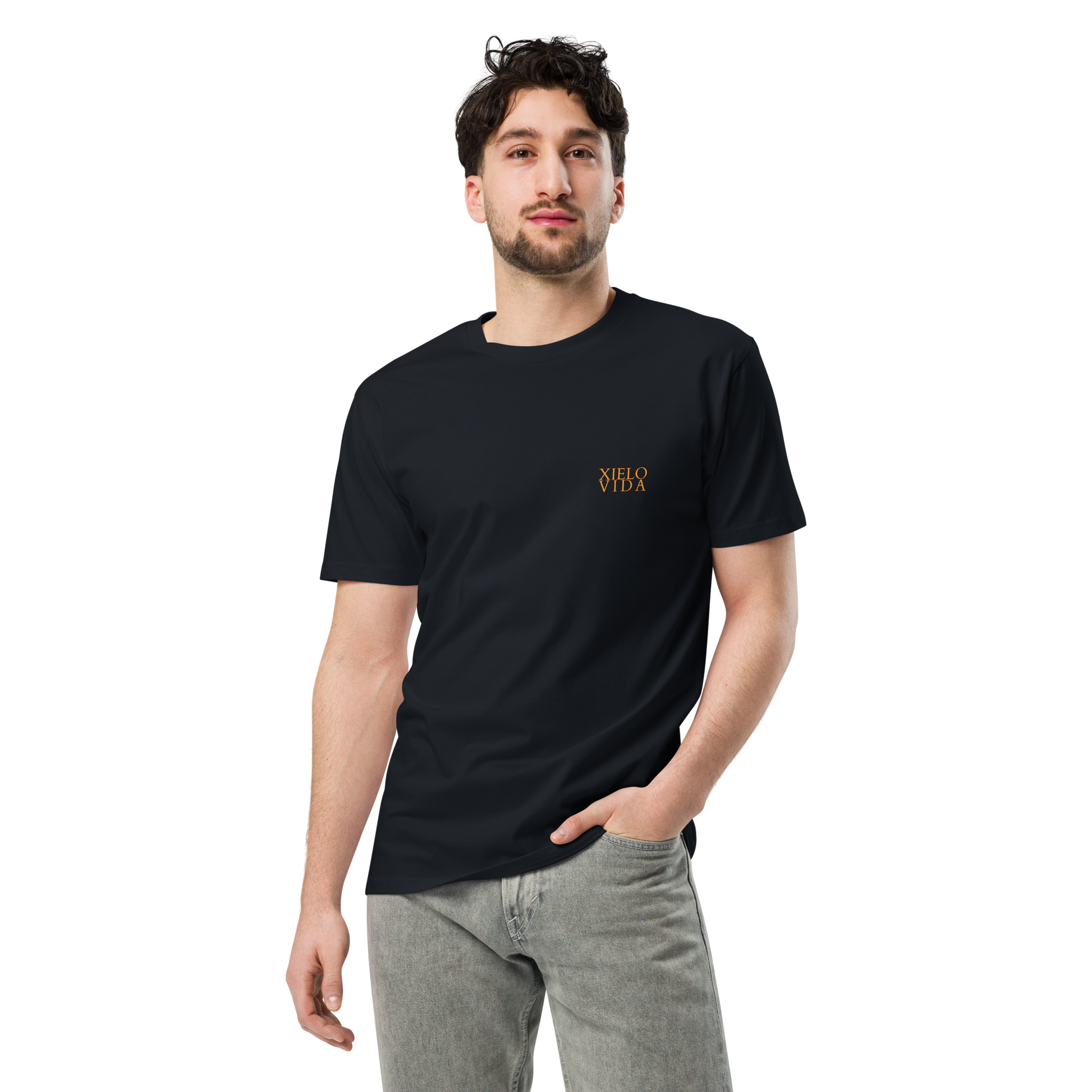 Male model wearing a navy premium mens t-shirt with the Xielo Vida logo in small gold lettering on the left chest.