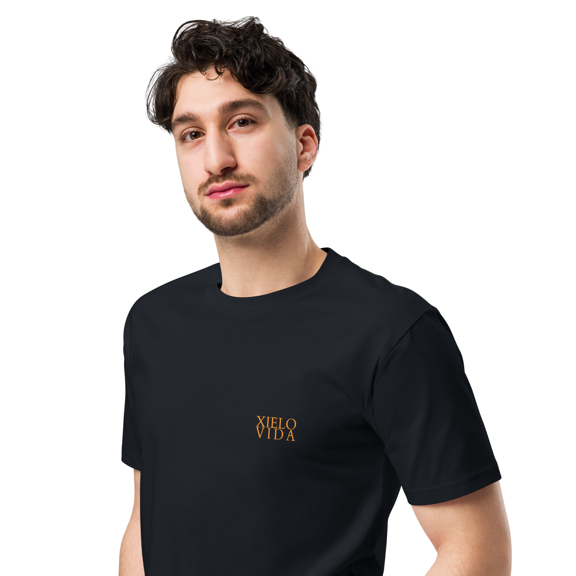 Male model wearing a navy premium mens t-shirt with the Xielo Vida logo in small gold lettering on the left chest.